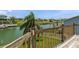 Elevated backyard view featuring a waterfront canal and waterfront homes with tropical landscaping at 4048 Bluefish Dr, Hernando Beach, FL 34607