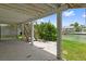 View of a staircase in backyard, next to a water canal and view of adjacent property at 4048 Bluefish Dr, Hernando Beach, FL 34607
