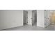 Basement hallway with views of the spiral staircase, and multiple interior doors at 4048 Bluefish Dr, Hernando Beach, FL 34607