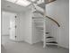 Basement featuring a unique spiral staircase, skylight, and white walls at 4048 Bluefish Dr, Hernando Beach, FL 34607