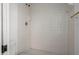 Tiled shower featuring white tile, updated fixtures, and clean finishes at 4048 Bluefish Dr, Hernando Beach, FL 34607