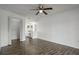 Spacious bedroom with hardwood floors, ceiling fan, and access to ensuite bathroom at 4048 Bluefish Dr, Hernando Beach, FL 34607