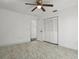 Clean bedroom with ceiling fan, spacious closet, and a light paint color at 4048 Bluefish Dr, Hernando Beach, FL 34607