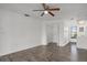 Bright bedroom with hardwood floors, ceiling fan, and a closet at 4048 Bluefish Dr, Hernando Beach, FL 34607