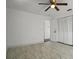 Bedroom featuring ceiling fan, closet, and a light paint color at 4048 Bluefish Dr, Hernando Beach, FL 34607