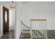 Bright foyer features beautiful hardwood floors and a classic staircase at 4048 Bluefish Dr, Hernando Beach, FL 34607