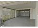 Garage space with partial lattice enclosure, white siding, and a white garage door at 4048 Bluefish Dr, Hernando Beach, FL 34607