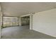 Garage area featuring lattice enclosure and white siding, plus concrete floor and walls at 4048 Bluefish Dr, Hernando Beach, FL 34607