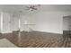 Expansive living area featuring wood floors, neutral walls, and ample space for entertaining at 4048 Bluefish Dr, Hernando Beach, FL 34607