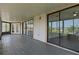 Spacious screened patio featuring sliding glass doors and views of the surrounding neighborhood at 4048 Bluefish Dr, Hernando Beach, FL 34607