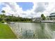 Picturesque canal with lush surroundings, providing a tranquil waterfront living experience at 4048 Bluefish Dr, Hernando Beach, FL 34607