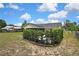Well-maintained backyard with a privacy hedge and ample green space for outdoor activities at 4072 Everett Ave, Spring Hill, FL 34609