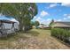 Spacious backyard with a swing and view of the home, offering privacy and ample space at 4072 Everett Ave, Spring Hill, FL 34609