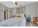 Bedroom featuring neutral tones, decorative wall art, and a comfortable-looking bed with accent pillows at 4072 Everett Ave, Spring Hill, FL 34609
