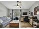 Home office with hardwood floors, a ceiling fan, a sofa and a desk for two at 4072 Everett Ave, Spring Hill, FL 34609