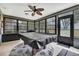 Bright recreation room featuring large windows and a pool table covered with a black leather top at 4072 Everett Ave, Spring Hill, FL 34609