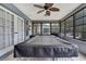 Bright sun room with a large pool table, ceiling fan and expansive windows offering natural light at 4072 Everett Ave, Spring Hill, FL 34609