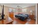 Cozy bedroom with hardwood floors, ceiling fan, and lots of natural light at 4350 Sawgrass Blvd, New Port Richey, FL 34653