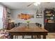 Spacious dining area with a large wooden table perfect for Gathering gatherings and entertaining guests at 4350 Sawgrass Blvd, New Port Richey, FL 34653