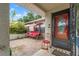 Welcoming front porch with a charming swing and seating, providing a relaxing outdoor space at 4350 Sawgrass Blvd, New Port Richey, FL 34653