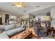 Inviting living area seamlessly connects to the kitchen and dining spaces, fostering a welcoming and communal atmosphere at 4350 Sawgrass Blvd, New Port Richey, FL 34653