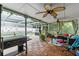Relaxing screened patio perfect for outdoor entertaining with plenty of seating and lush backyard views at 4350 Sawgrass Blvd, New Port Richey, FL 34653
