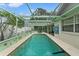 Bright enclosed pool area with plenty of sunlight, offering a great spot for year-round swimming and recreation at 4350 Sawgrass Blvd, New Port Richey, FL 34653