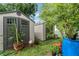 Backyard featuring two storage sheds that offer practical solutions for organizing outdoor equipment and tools at 4350 Sawgrass Blvd, New Port Richey, FL 34653