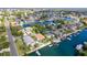 Real estate featuring a waterfront community with private docks, pools, and lush landscaping at 4460 Flounder Dr, Hernando Beach, FL 34607