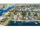 Stunning aerial view of waterfront home on canal with boat dock and pool in Hernando Beach, FL at 4460 Flounder Dr, Hernando Beach, FL 34607