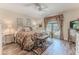 Inviting bedroom with floral accents, featuring natural light and a cozy seating area at 4460 Flounder Dr, Hernando Beach, FL 34607