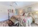 Charming bedroom with floral bedding, plush pillows, and stylish décor creating a cozy atmosphere at 4460 Flounder Dr, Hernando Beach, FL 34607