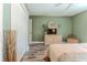 Relaxing bedroom with earth-tone walls, plank flooring, and wicker dresser, creating a serene atmosphere at 4460 Flounder Dr, Hernando Beach, FL 34607