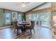 Dining room highlights an elegant table with seating and serene outdoor views at 4460 Flounder Dr, Hernando Beach, FL 34607