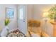 Bright foyer features wood-look floors, door to the exterior, and decorative accents at 4460 Flounder Dr, Hernando Beach, FL 34607