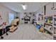 Spacious garage with ample storage, shelving, workbench, and utility sink, ideal for hobbies and projects at 4460 Flounder Dr, Hernando Beach, FL 34607
