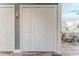 Hallway with closet and doorway leading to bedroom with floral bedspread and carpet at 4460 Flounder Dr, Hernando Beach, FL 34607