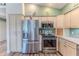 Kitchen featuring stainless steel appliances, wood cabinets, and granite countertops at 4460 Flounder Dr, Hernando Beach, FL 34607