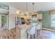 Bright kitchen with stainless steel appliances, wood cabinets, and center island with seating at 4460 Flounder Dr, Hernando Beach, FL 34607