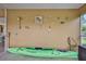 A wall in the lanai is decorated with seahorse and starfish wall hangings and has a kayak stored in the corner at 4460 Flounder Dr, Hernando Beach, FL 34607