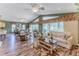 Spacious living room features hardwood floors, neutral tones, and views of the patio at 4460 Flounder Dr, Hernando Beach, FL 34607