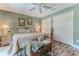 Relaxing main bedroom with a seating bench, wood flooring, and ensuite bathroom at 4460 Flounder Dr, Hernando Beach, FL 34607