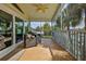 This waterfront screened patio offers ample seating and partial views of the surrounding lush foliage and water at 4460 Flounder Dr, Hernando Beach, FL 34607
