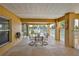 Covered outdoor patio provides a comfortable space for dining with views of the water and backyard at 4460 Flounder Dr, Hernando Beach, FL 34607
