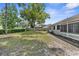Expansive backyard with lush green grass and a privacy fence; great for entertaining at 5035 Harbinger Rd, Spring Hill, FL 34608
