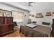 Inviting bedroom with a large window providing natural light and a ceiling fan at 5035 Harbinger Rd, Spring Hill, FL 34608