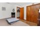 Bedroom boasts a closet, neutral walls, and wooden floors; serene retreat at 5035 Harbinger Rd, Spring Hill, FL 34608