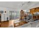 Inviting living room with wood floors and sliding doors to an enclosed patio at 5035 Harbinger Rd, Spring Hill, FL 34608