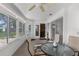 Bright sunroom with large windows, providing an outdoor view and access to backyard at 5035 Harbinger Rd, Spring Hill, FL 34608