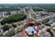 Stunning aerial view of home featuring a private backyard pool in a lush, residential neighborhood at 5249 Wellfield Rd, New Port Richey, FL 34655